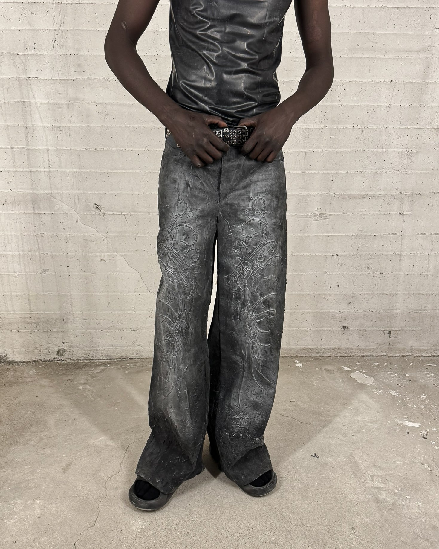 LATEX COATED JEANS WITH RELIEF